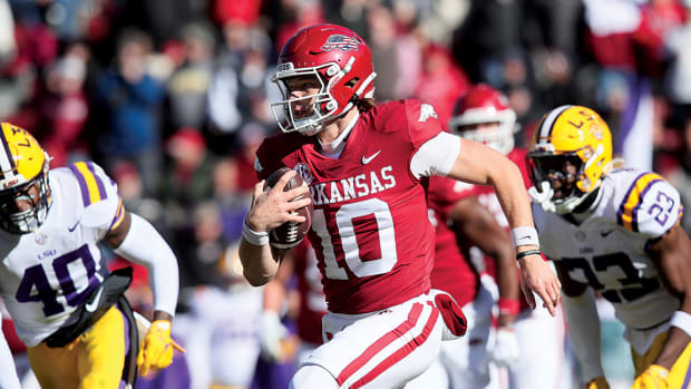 Arkansas quarterback Cade Fortin rushes against the LSU Tigers.